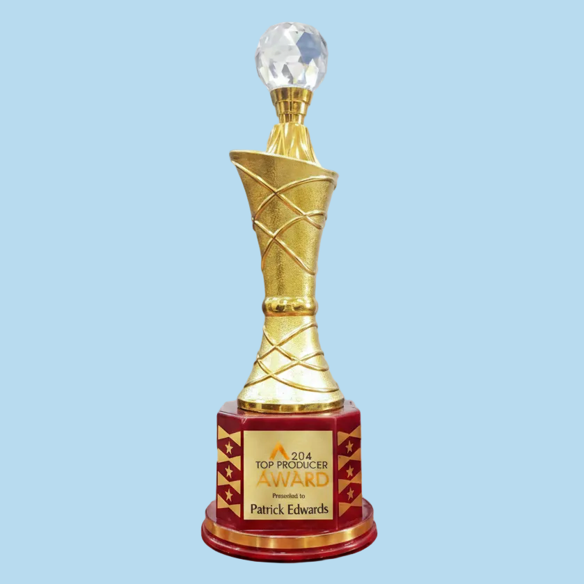 Decorative award trophy with gold and red design, featuring a crystal ball on top.