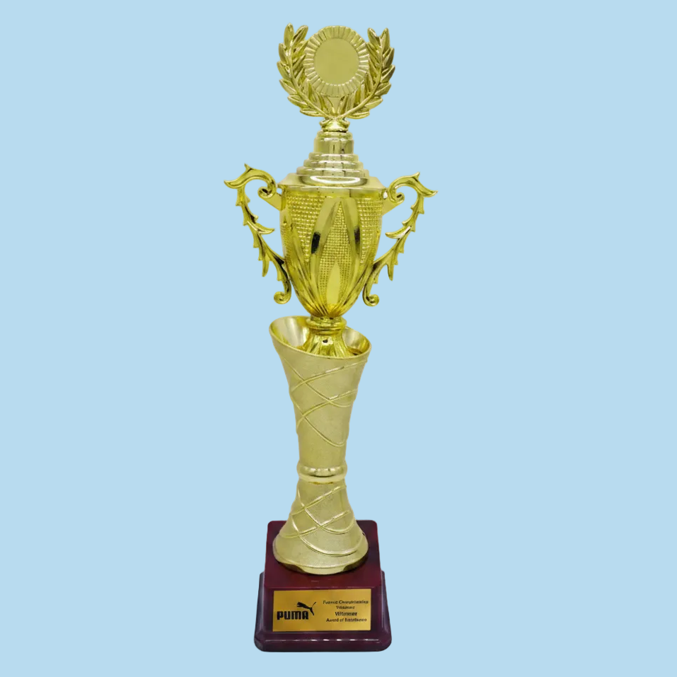 Gold trophy with a Puma plaque on a red base