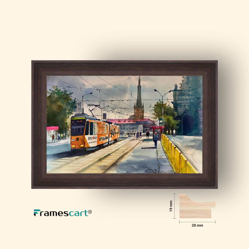 Framed artwork of a tram on a street with a clock tower, displayed on a light beige background.